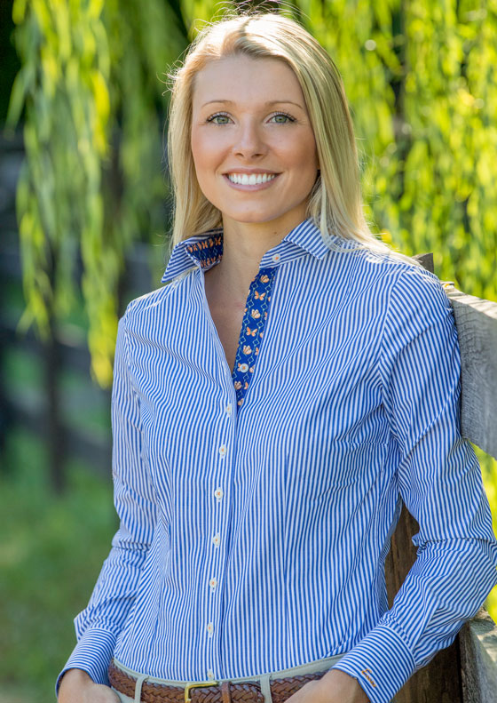 Emily wearing blue pin stripe dora fashion shirt